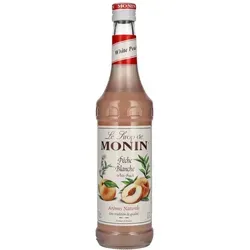 Le Sirop de Monin WEIßER PFIRSICH 0,7l - Premium-Sirup - Der Le Sirop de Monin Weißer Pfirsich 0,7 l überzeugt mit seinem eleganten, fruchtigen Aroma. Ideal für Cocktails, Desserts und kreative Getränke, bringt er den authentischen Geschmack sonnengereifter Früchte in Ihre Küche.