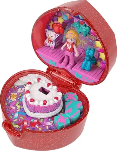 Polly Pocket 80th Anniversary Ruby Red Ring Box Collector Compact - Feiere 80 Jahre Mattel mit der herzförmigen Ringetui-Schatulle von Polly Pocket! Enthält eine Puppe, ein Ballontier und einen anpassbaren Ring. Perfekt für kreative Spielstunden und große Abenteuer!