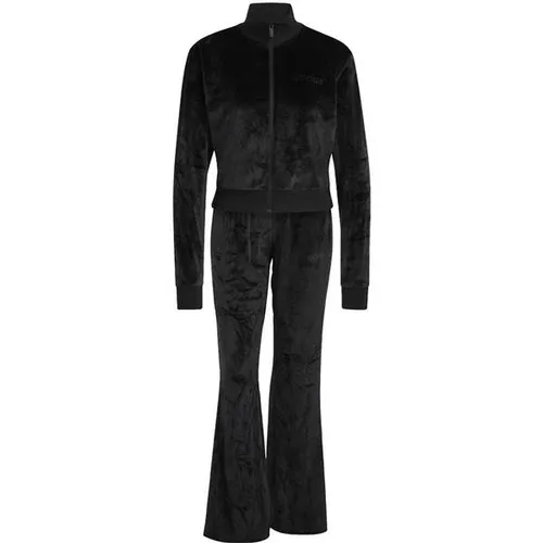 adidas Glam Velvet Tracksuit für Damen, Schwarz, XL - Stylischer, schmal geschnittener Trainingsanzug aus 94 % recyceltem Polyester, ideal für lässige Outfits. Der ausgestellte Saum und der geprägte adidas Schriftzug setzen modische Akzente.