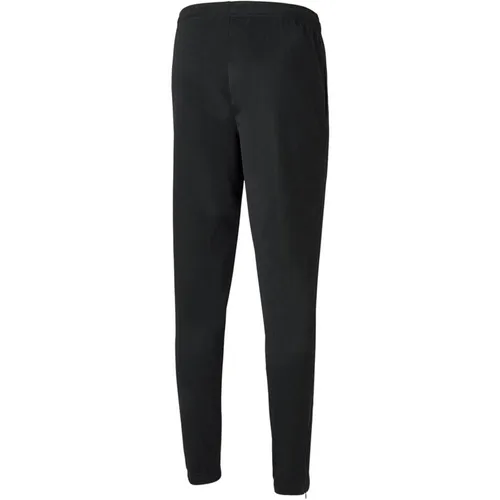 Puma teamRISE Poly Training Pants - XL - Sportliche Poly Training Pants von Puma, ideal für jedes Training. Die bequeme Passform und das atmungsaktive Material sorgen für optimalen Komfort während des Sports. Perfekt für aktive Freizeitgestaltung!  