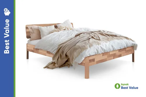 byoak Massivholzbett PENNY mit Holzkopfteil - Massivholz-Bett für stilvollen Schlafkomfort, gefertigt aus nachhaltiger Wildeiche oder Kernbuche. Ideal für jedes Schlafzimmer, bietet es Stabilität und natürliche Eleganz.