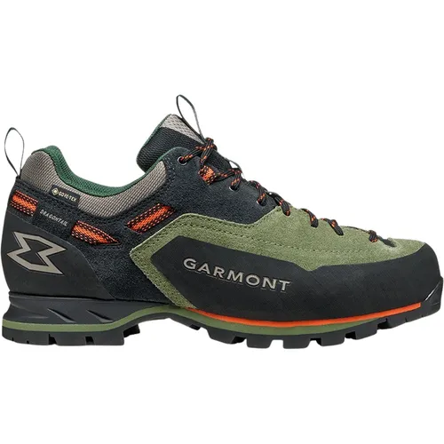 Garmont Dragontail MNT Evo GTX Herren Zustiegsschuhe – wasserdicht und stabil | Black/Olivine EU 46,5 - Die Garmont Dragontail MNT Evo GTX Zustiegsschuhe bieten hohen Komfort und Stabilität. Mit wasserdichter GORE-TEX® Membrane und strapazierfähigem Veloursleder sind sie ideal für anspruchsvolle Touren und bieten ausgezeichneten Halt auf jedem Terrain.