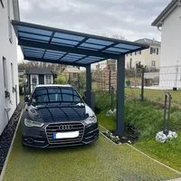 Ximax Einzelcarport Wing Typ 80 mit Welldach Anthrazit - Carport aus pulverbeschichtetem Aluminium mit hitzeabweisendem Polycarbonat-Dach in Rauchglasblau, stabil und korrosionsbeständig, ideal für jede Umgebung.