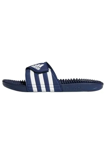Adidas Adissage - Blau Badesandalen - Weiche Slipper mit weitenregulierbarem Riemen und dämpfender Zwischensohle. Die Massagenoppen auf dem Fußbett bieten zusätzlichen Komfort nach dem Workout.