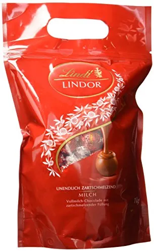 Lindt Lindor Beutel Vollmilch 1 kg - Sortimentpackungen für Pralinen mit ca. 80 einzeln verpackten, glutenfreien Lindor Kugeln – ideal für Geschenke oder zum Genießen. Erleben Sie die zartschmelzende Füllung der Vollmilch-Schokolade!
