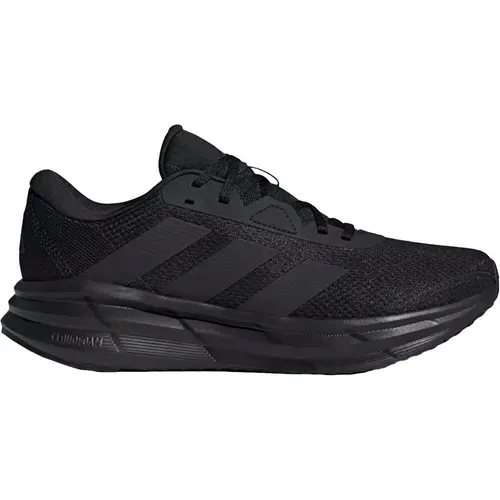 Adidas Galaxy 7 Running - schwarz - Laufschuhe mit Cloudfoam-Mittelsohle für optimalen Komfort und Dämpfung, ideal für Läufer aller Leistungsstufen. Atmungsaktiv und mit hervorragendem Grip für alle Untergründe.