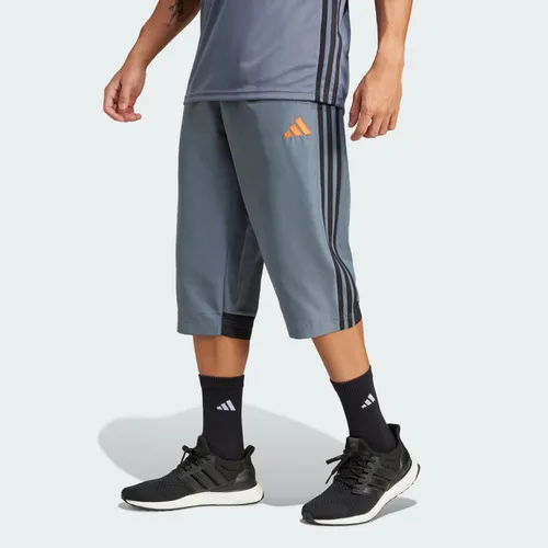adidas Performance TIRO 25 Trainingshose 3/4 orange|schwarz XS - Trainingsbekleidung aus 100% recyceltem Polyester, ideal für Fußball und umweltbewusste Sportler. Bequemer Kordelverschluss und moderne 3/4-Länge.