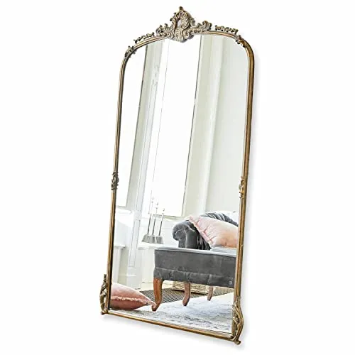 Loberon Spiegel Choni - Antiker Wandspiegel mit Ornamentverzierungen - Eleganter Wandspiegel im antiken Look, verziert mit üppigen Ornamenten. Ein stilvolles Wohn-Accessoire aus Eisen und Polyresin, das jedem Raum einen Hauch von Nostalgie verleiht.
