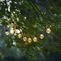 LED Solar Lichterkette 10 klare Kugeln mit warmweißer LED Lichtsensor Garten