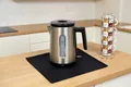 FireMat Feuerfeste Unterlage für Elektrogeräte wie Kaffeemaschinen, Mikrowelle, Wasskocher, Toaster Kochen auf Induktionsherd möglich. Black Edition (35x65cm)