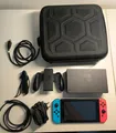 Nintendo Switch Spielkonsole mit Tragetasche (HAC-001, 32GB, Neon-Rot/Neon-Blau)