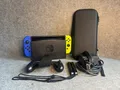 Nintendo Switch 1 V2 (HAC-001-01) 32GB (blau/gelb) inkl. Tasche