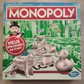 Hasbro 0417C1009100: Monopoly - Das berühmte Spiel um den großen Deal [Gesellsch